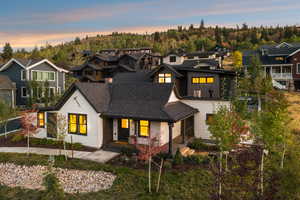 View of front facade with a porch, a residential view, and board and batten siding