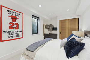 Bedroom featuring recessed lighting, carpet flooring, and a closet