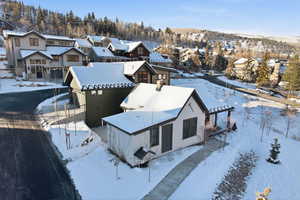 Snowy aerial view with a residential view