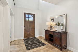 Entryway featuring light wood-style flooring and baseboards