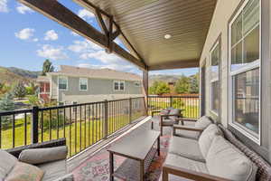 Balcony with an outdoor living space and a mountain view