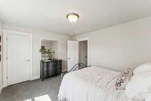 Carpeted bedroom with baseboards