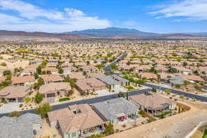 Aerial perspective of suburban area featuring a mountainous background