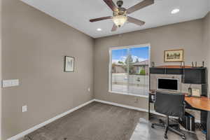 Carpeted home office featuring recessed lighting and ceiling fan