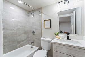 Bathroom with shower / bath combination and vanity