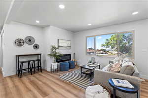 Living room featuring recessed lighting and light wood finished floors