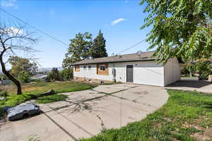 View of front facade with a front yard and brick siding