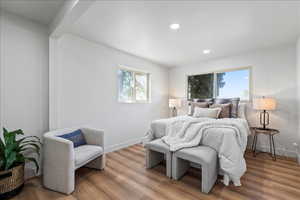 Bedroom with light wood-type flooring and recessed lighting