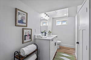 Bathroom featuring vanity and light wood-style floors