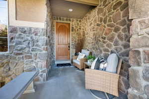 Doorway to property with stone siding