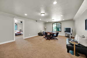 Dining space with recessed lighting, light colored carpet, a textured ceiling, and a ceiling fan