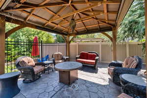 View of patio / terrace with outdoor lounge area and a gazebo