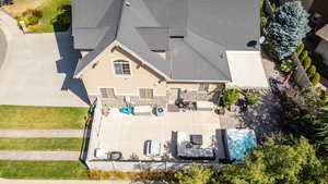 Aerial view of property and surrounding area featuring a pool area