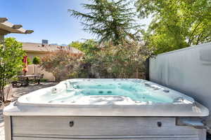 View of patio / terrace with a hot tub