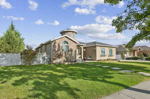 View of front of house with stone siding and stucco siding