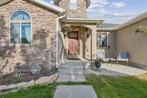 Entrance to property featuring front porch