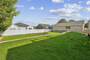 Large, fenced tiered back yard and separate six-car garage/workshop.