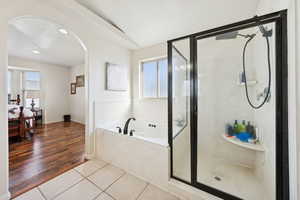 Primary ensuite with separate garden tub and shower with seat
