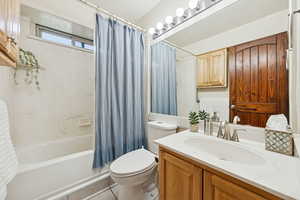Full hall bath featuring shower / bathtub combination and light tile