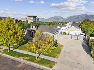 Aerial view of front of home with a mountainous background