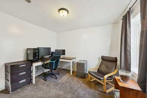 Bedroom #5 with carpet and a textured ceiling