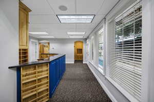Reception area featuring a paneled ceiling and arched walkways