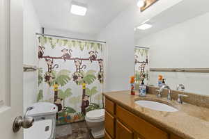 Full bathroom with shower / tub combination, vanity