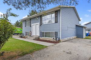 Side View of property featuring driveway
