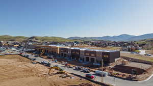 Aerial perspective of suburban area featuring a mountainous background