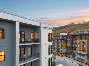Property at dusk featuring a mountain view