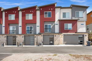 Contemporary house featuring a residential view and stone siding