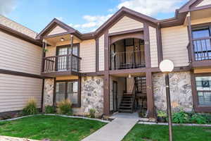 View of property with stairway