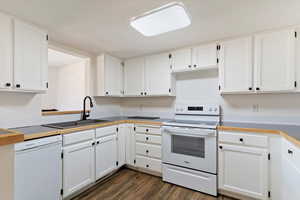 Kitchen with white appliances and white cabinets