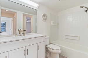 Bathroom with vanity and shower / bath combination