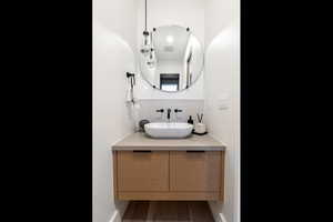 Bathroom with decorative backsplash and vanity