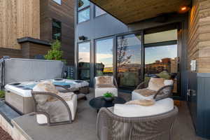 View of patio / terrace with a hot tub