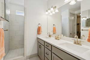 Master Bathroom featuring a walk in shower and double vanity