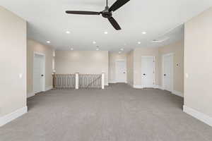 Unfurnished room with light carpet, recessed lighting, and a ceiling fan