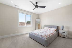 Bedroom with carpet flooring, a ceiling fan, and recessed lighting