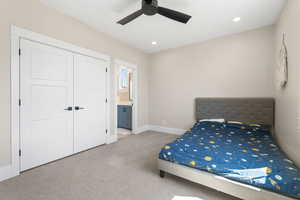Bedroom with carpet flooring, ensuite bathroom, recessed lighting, a closet, and ceiling fan