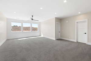 Spare room with recessed lighting, carpet floors, and ceiling fan