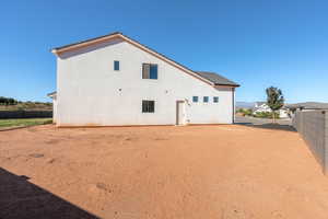 Back of property with stucco siding