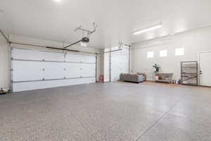 Garage featuring a garage door opener