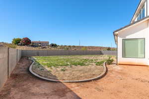 View of fenced backyard