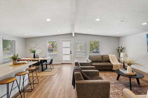 Large windows and glass door let in lots of natral light