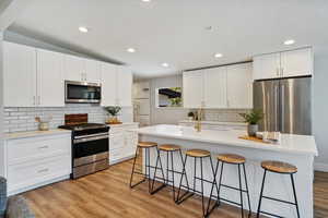 Classic white kitchen with stainless steel appliances