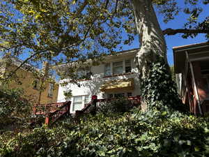 Back of house with a deck