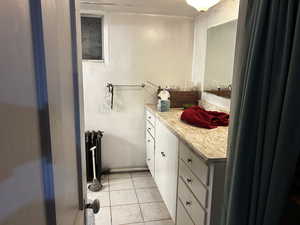 Half bath with vanity and radiator