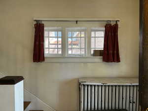 Staircase with radiator and plenty of natural light