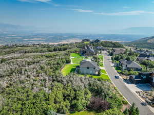Aerial view of residential area featuring a mountainous background